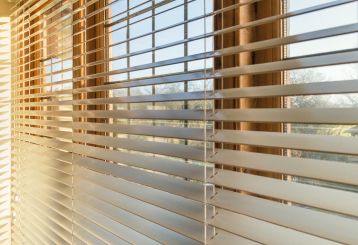 Woven wood blinds adding a natural touch to a sunroom window