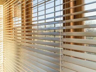 Woven wood blinds adding a natural touch to a sunroom window