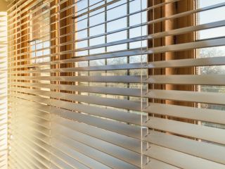 Woven wood blinds adding a natural touch to a sunroom window