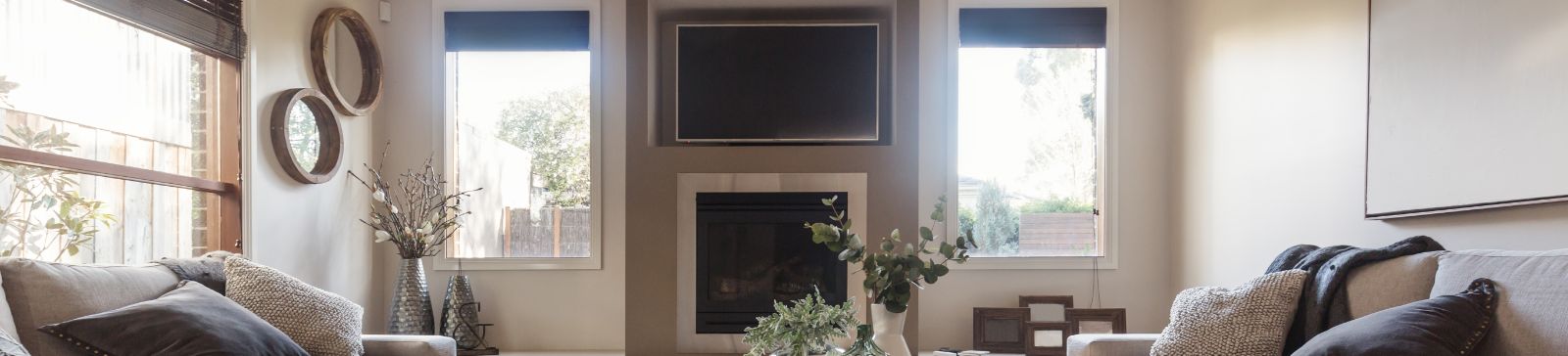 A view at a modern living room with Roman window shades